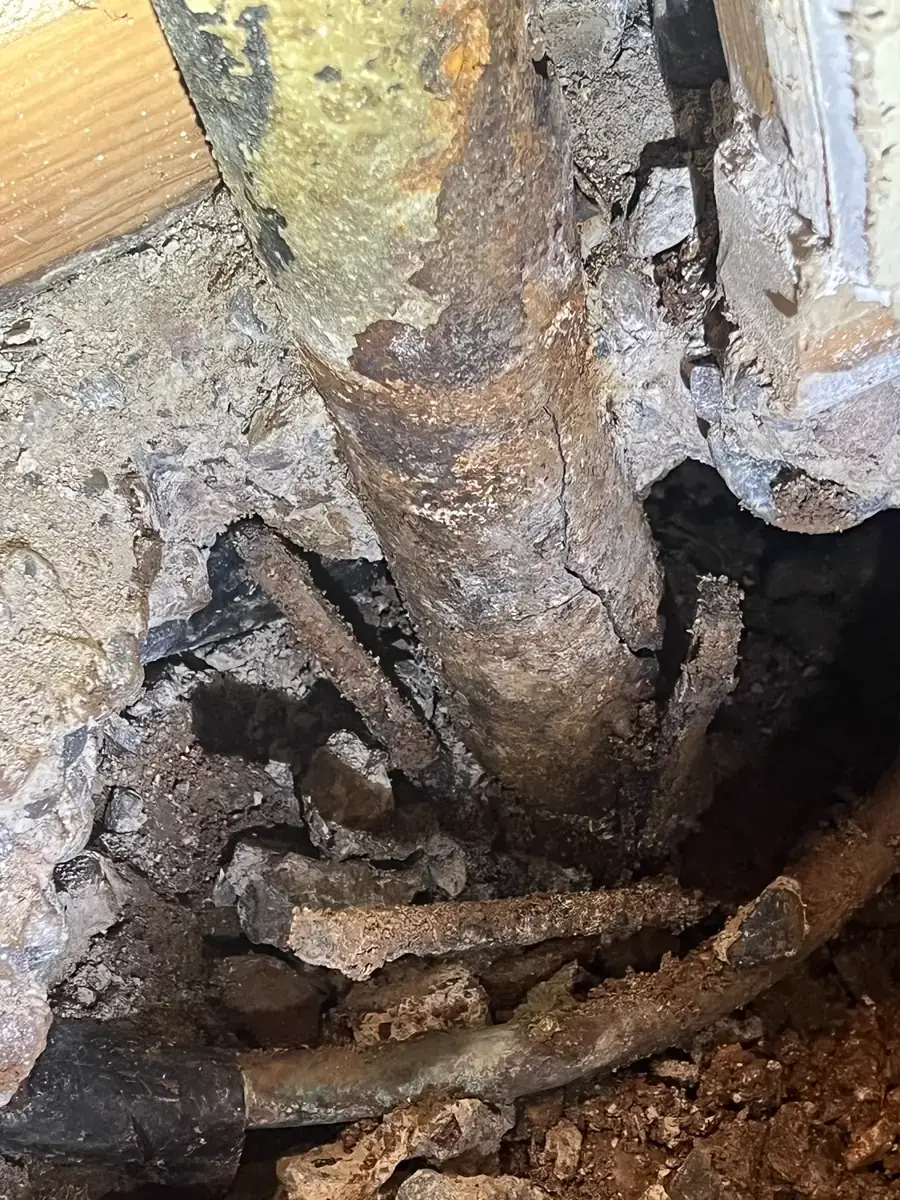 Corroded copper line under the slab, the cause of the leak