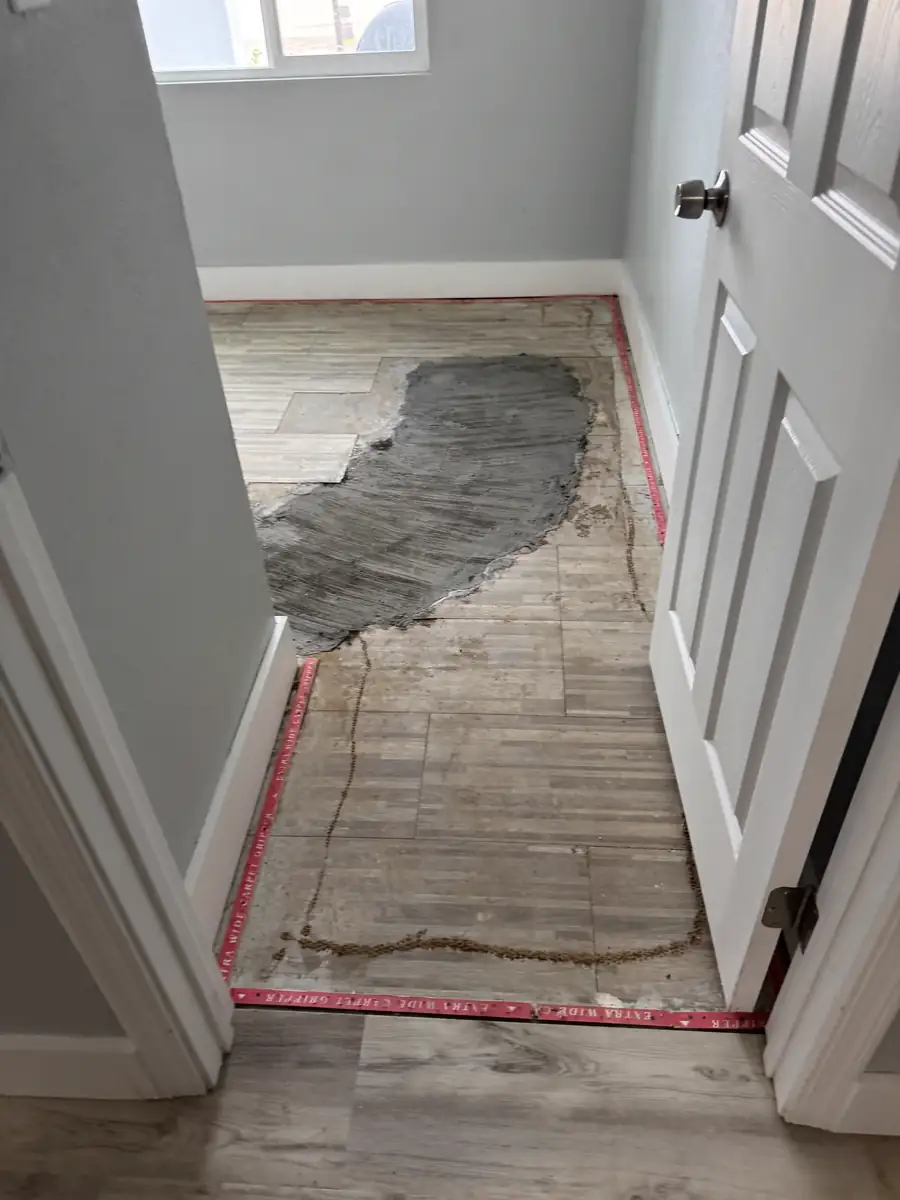 After: slab leak repaired and the concrete patched flush with the floor